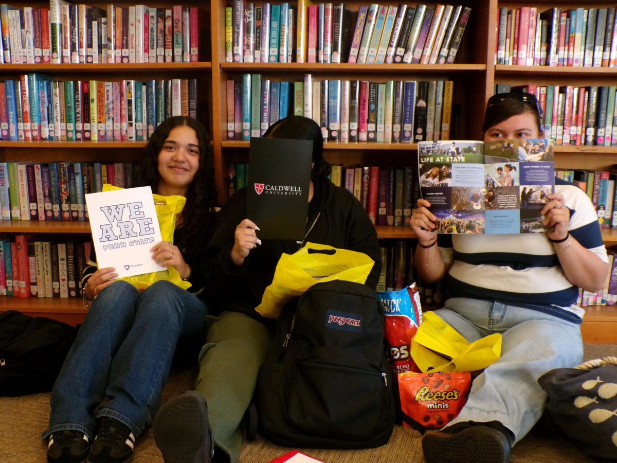 Back in the CIHS library, students review the material received at the Molloy event.